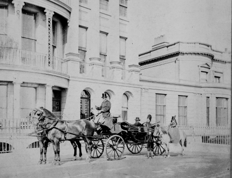 Photo of a coachman and coach in front of Brunswick Terrace in the 1860s