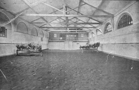 Monochrome image of the inside of the riding school