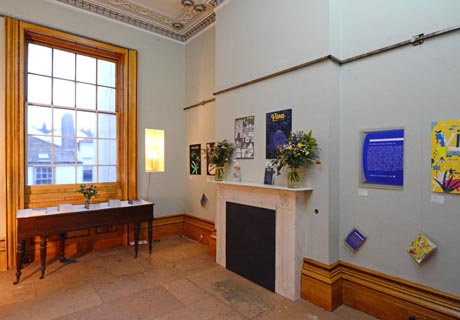 View of rear drawing room showing exhibition of Viva magazine covers.