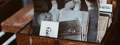 Photo of old photographs in a wooden box