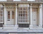Front elevation of Raven Row showing doorways with columns and decoration over, flanking a Georgian-pattern window