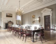 Photograph showing the Old Court Room art Skinners' Hall, an ornate room with a long wooden table surrounded by chairs
