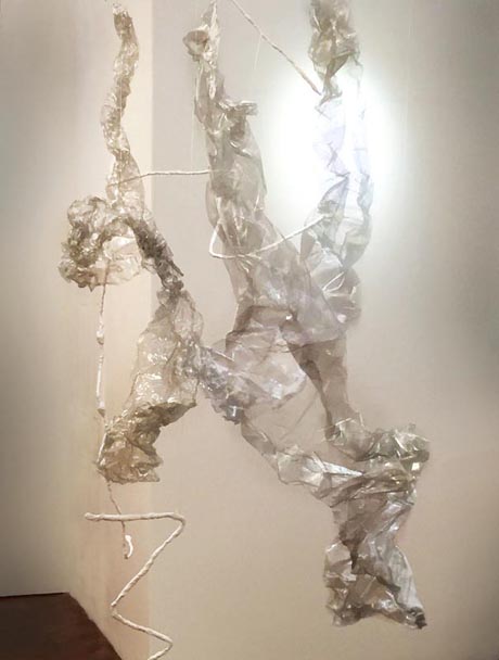 Abstract sculpture made of clear plastic wrapped around wire