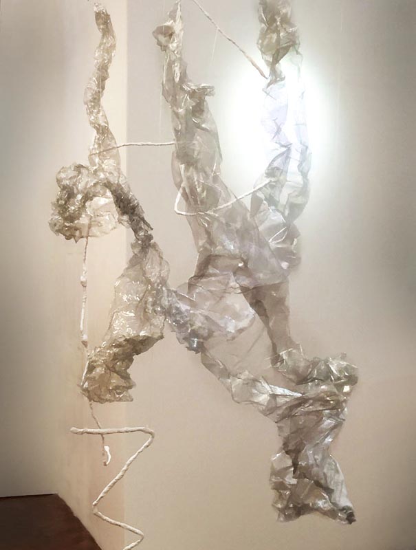 Artwork comprising suspended crumpled cellophane over a wire armature