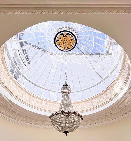 Photo of restored intricate plasterwork and roof-light