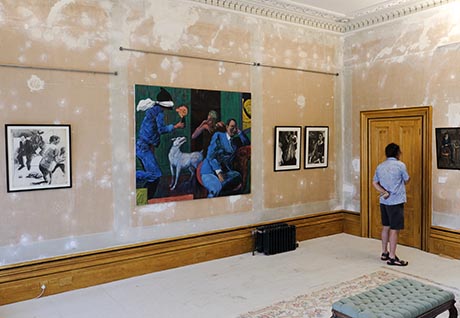 View of drawing room showing three artworks on the wall