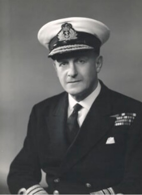 A monochrome photo of a man in naval uniform