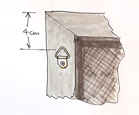 Drawing showing the location of a hanging loop on the rear of a picture frame