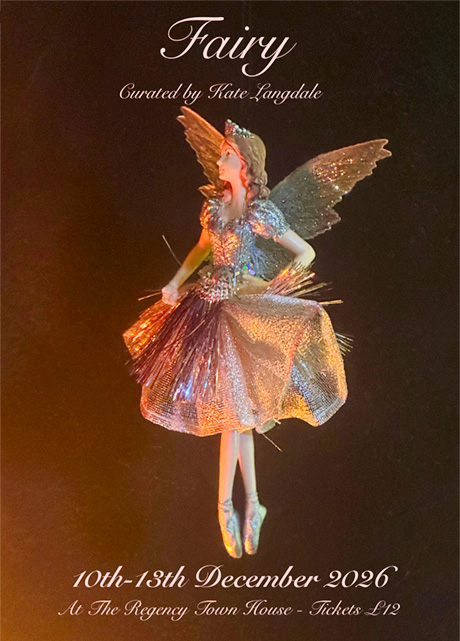 Photo of a Christmas Tree fairy, with silver dress and wings.