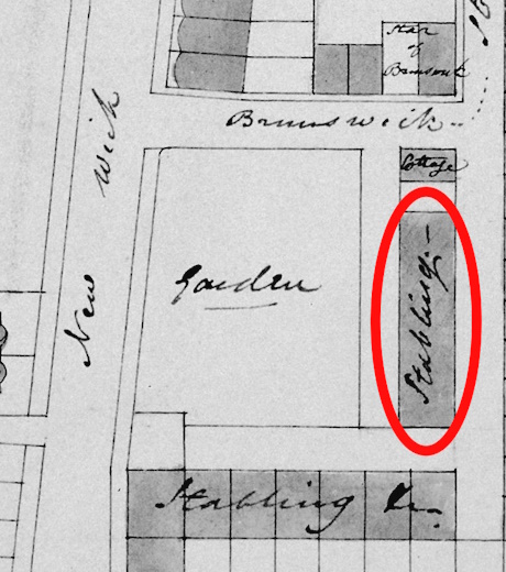 An image of an old map with a red elipse marking one building