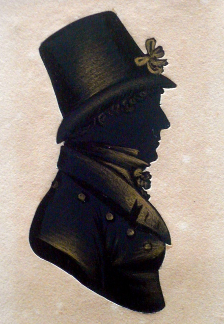 Silhouette profile of a gentleman in regency clothing facing right